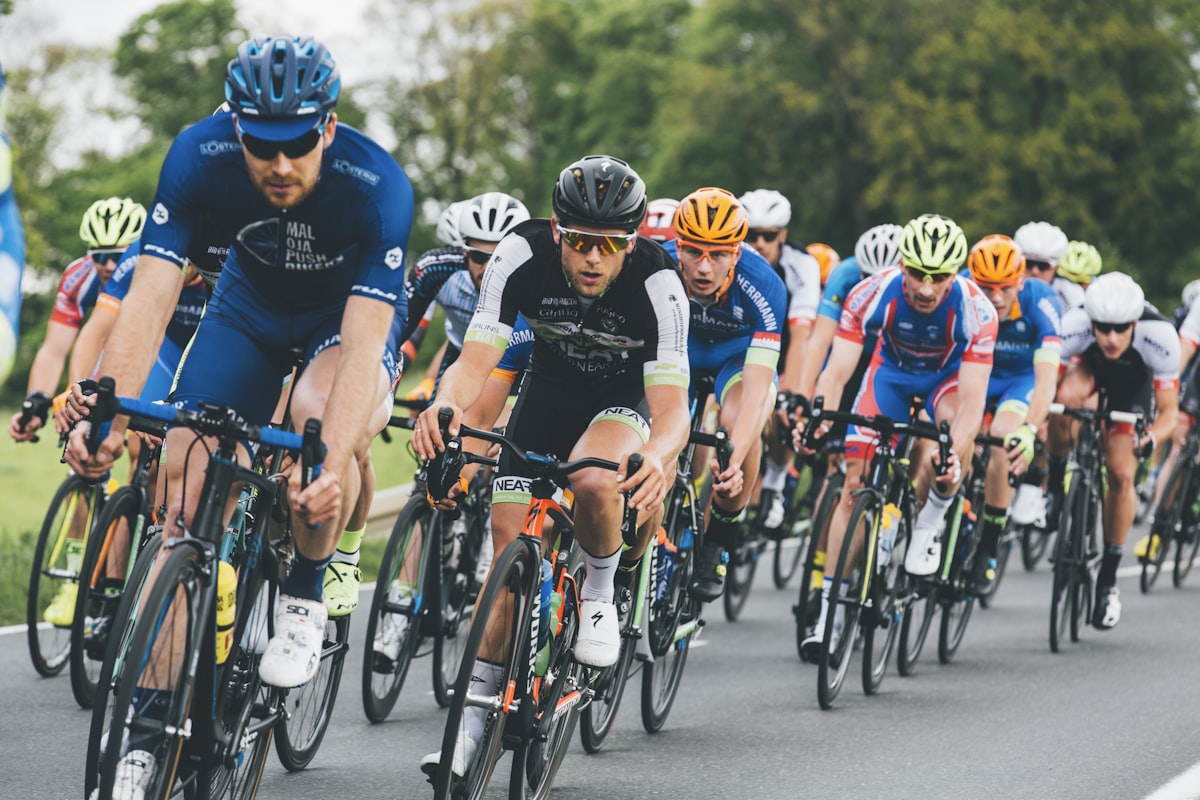 Cyclists racing neck and neck in a tight peloton, illustrating a finish down to the wire