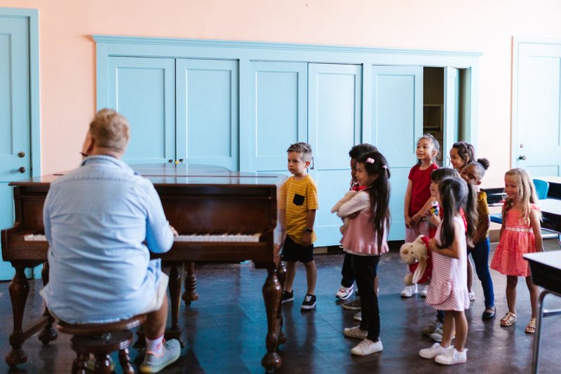 Teacher leading an action song, a common Total Physical Response technique