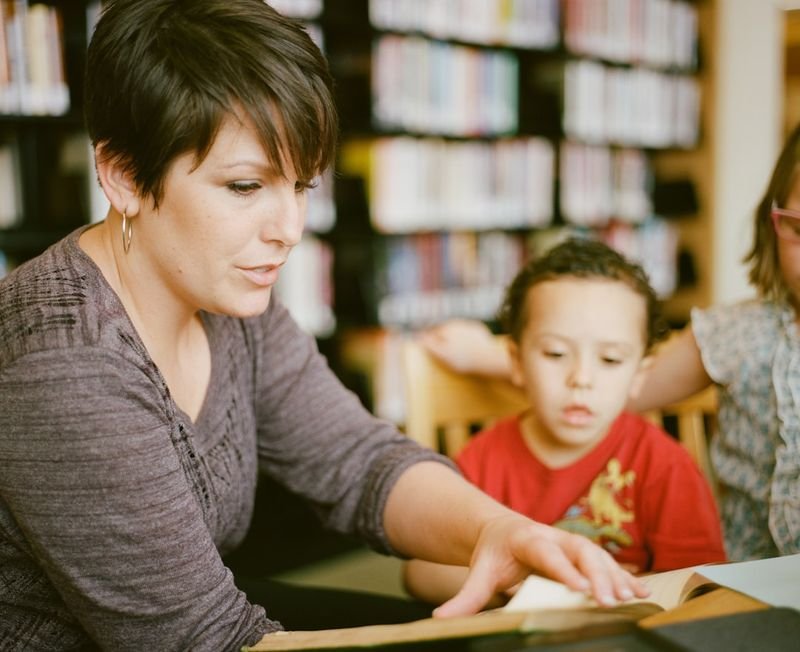 ESL teacher explaining homework assignment clearly to students