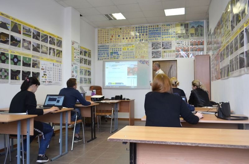 ESL students completing a quiz show question formation activity in class
