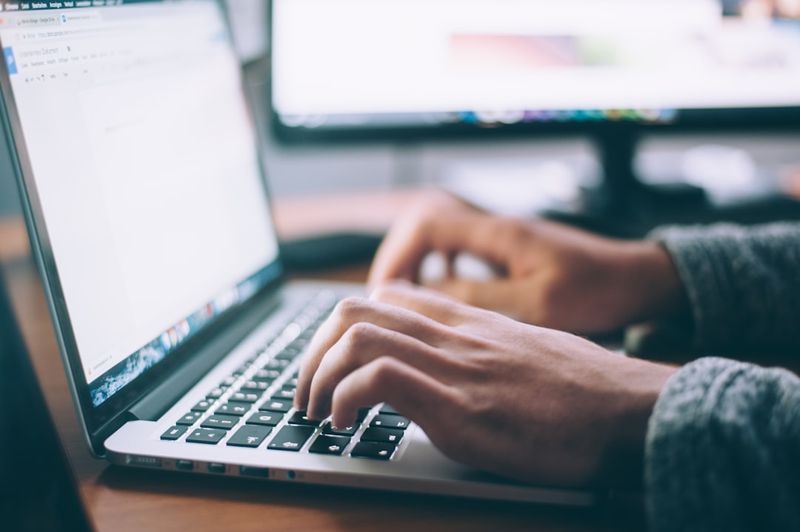 Workplace English learners practicing professional email closings