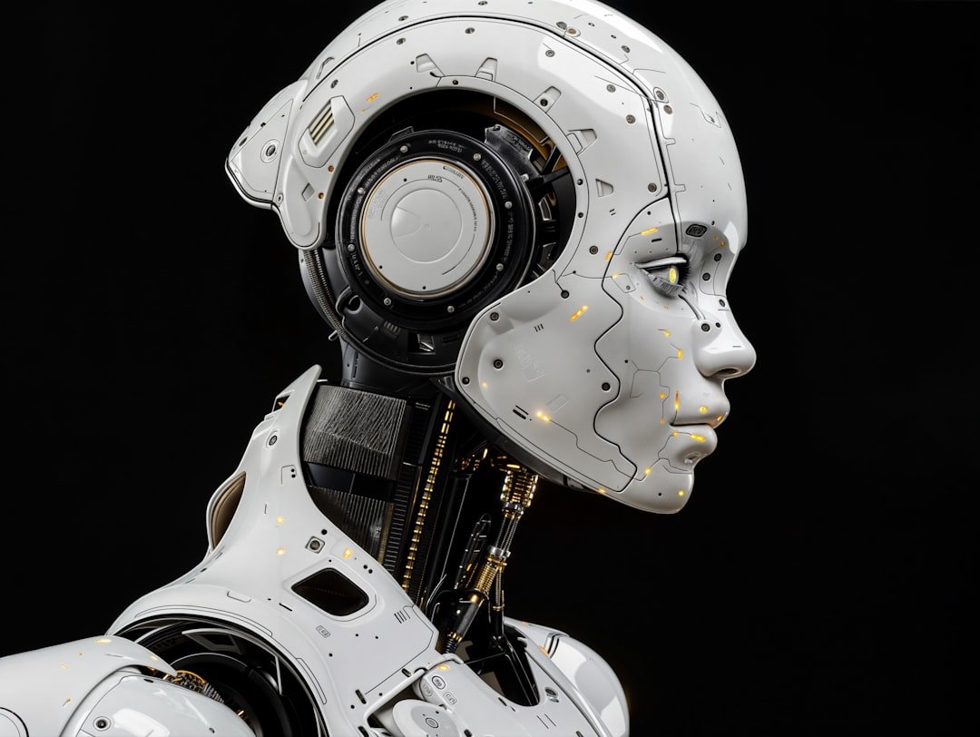 A face of a humanoid robot, side view on black background