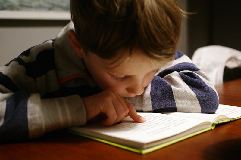ESL student choosing a graded reader book for extensive reading program