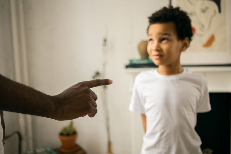 Father and son talking, illustrating the idiom like father like son