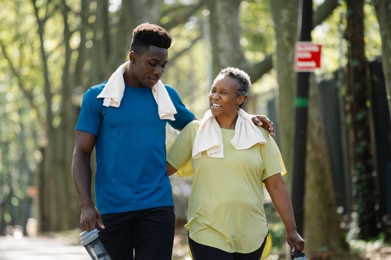 Family walking together representing follow in your parents footsteps idiom