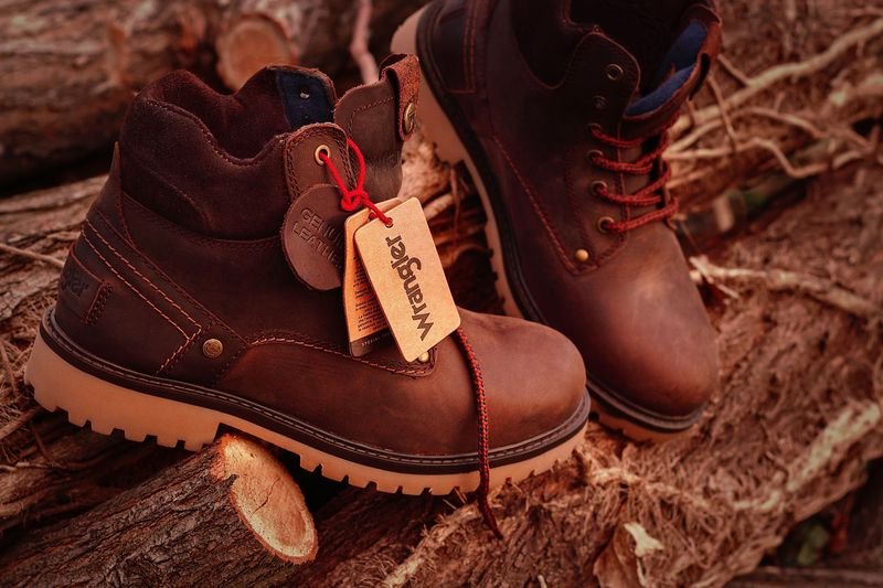 Close-up of stylish leather boots illustrating the English idiom give someone the boot
