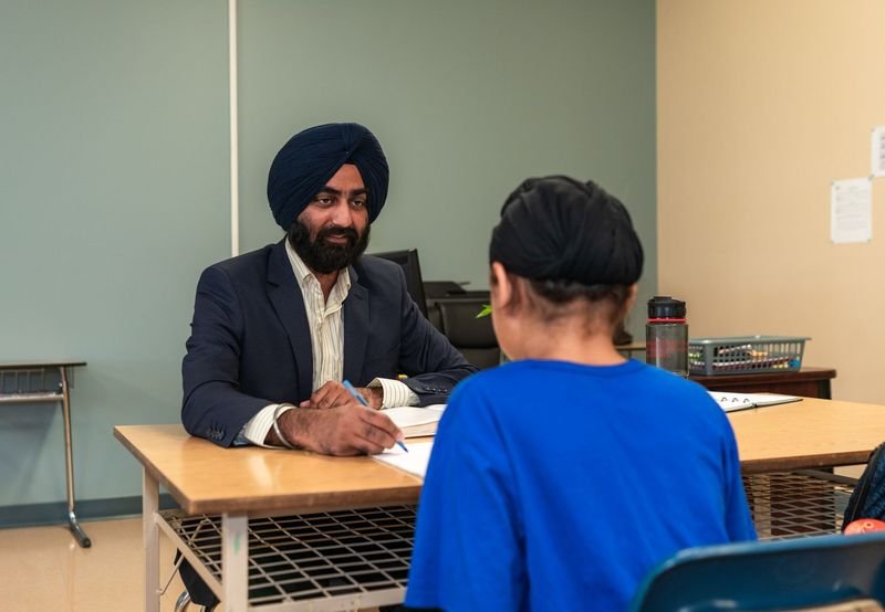 Teacher providing one on one support to reduce ESL student anxiety