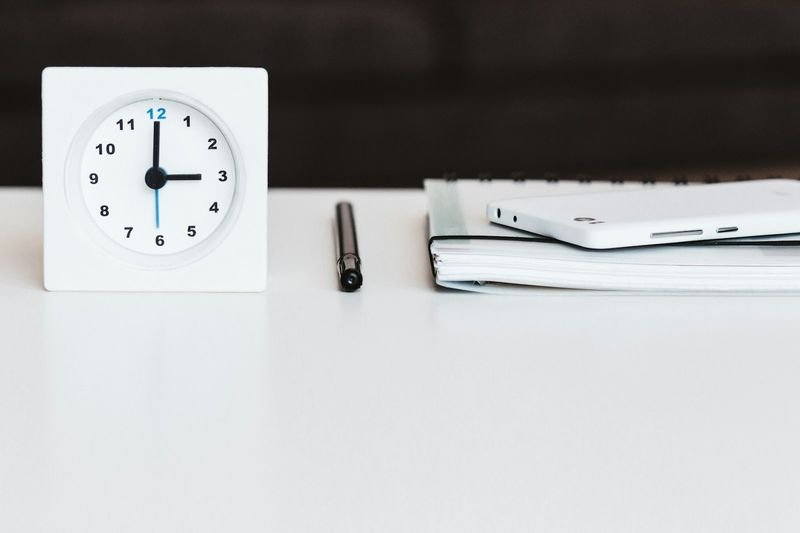 A clock and planner representing time management for buxiban teaching