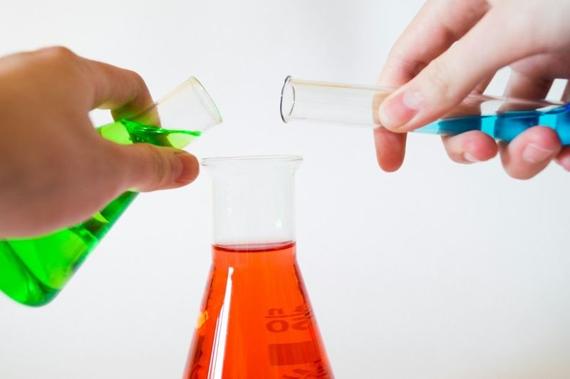 ESL students doing a science experiment as part of content-based instruction
