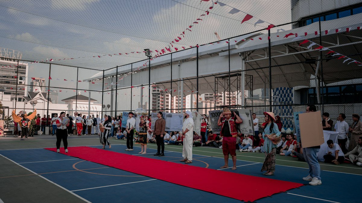 A red carpet laid out for an event entrance, illustrating roll out the red carpet