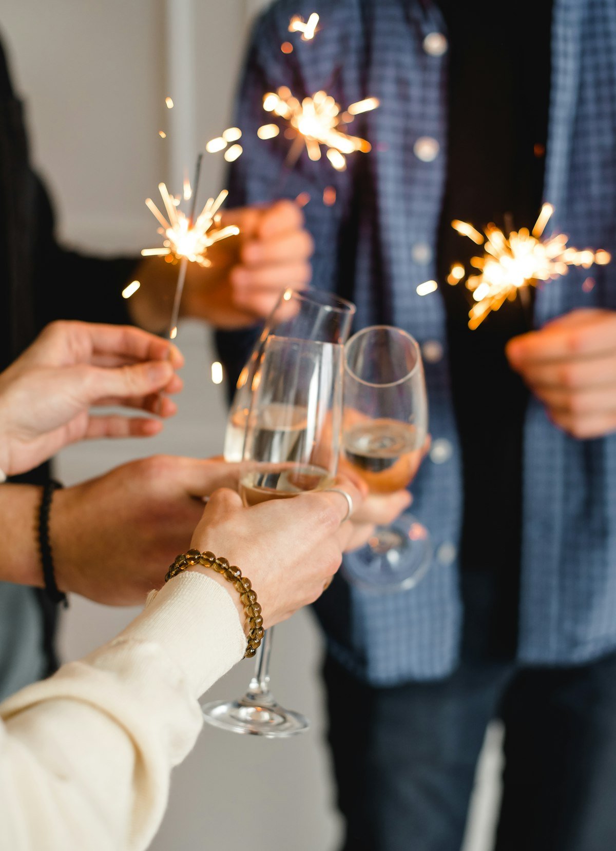 Friends raising a toast together at a celebration, illustrating raise a toast and ring in the new year