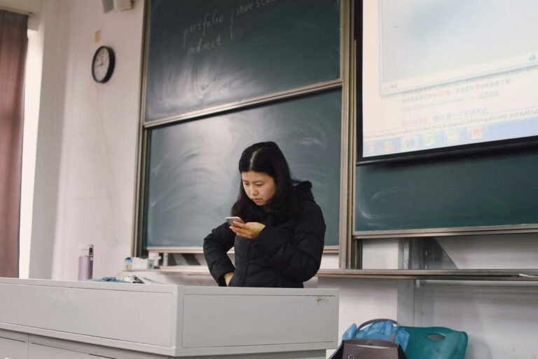 ClassDojo for teachers app open on a phone in an ESL classroom