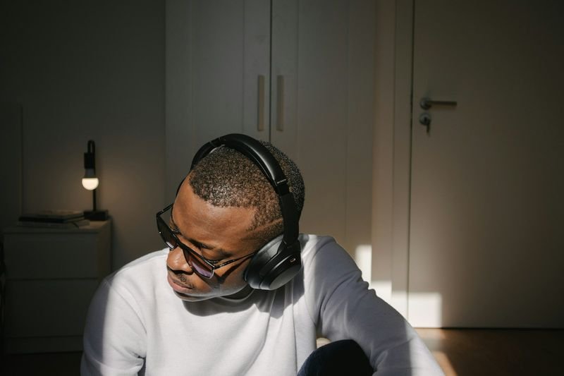 ESL student using headphones for Duolingo listening practice