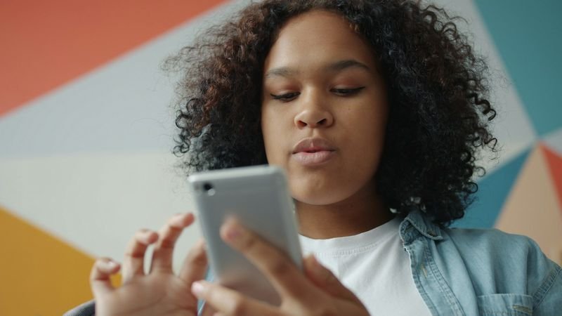 student using Duolingo language learning app on smartphone