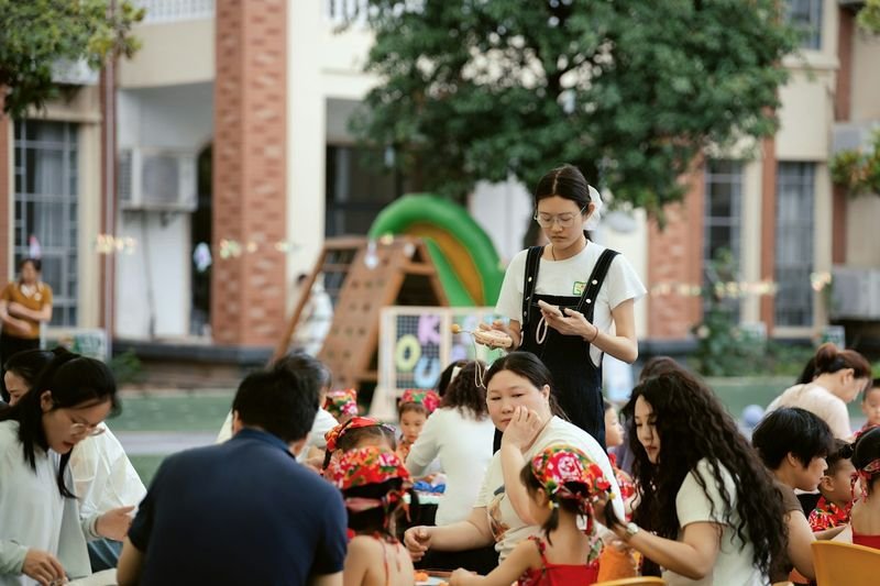 School staff welcoming ESL families at a community event