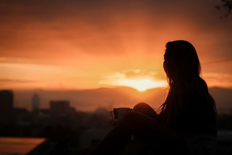 A tired teacher relaxing at sunset after a long day of buxiban teaching