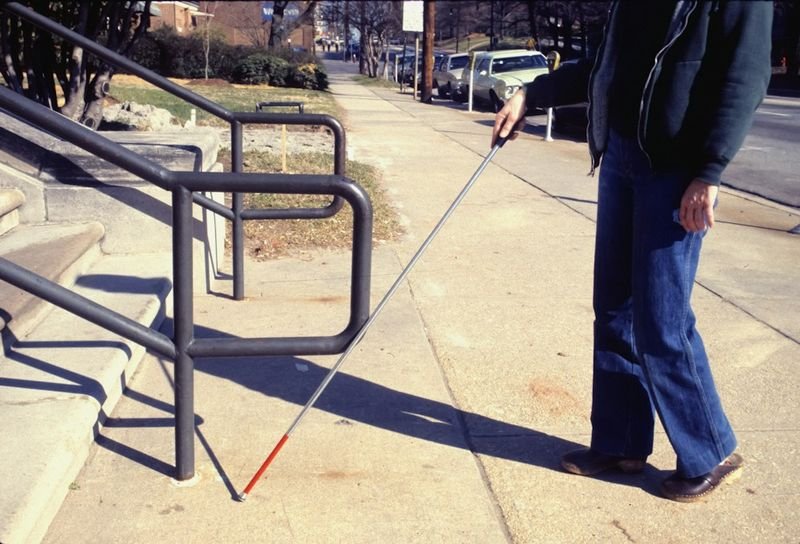 visually impaired student navigating the classroom with a cane