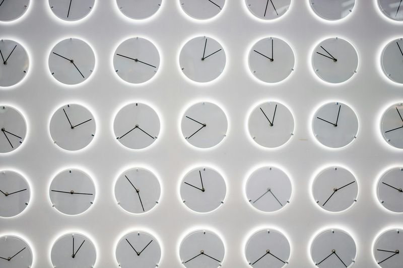 Clocks representing timed IELTS Writing Task 2 exam practice