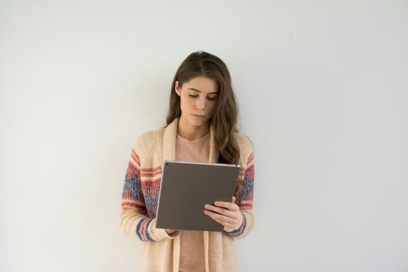 Student completing a LiveWorksheets interactive worksheet on a tablet