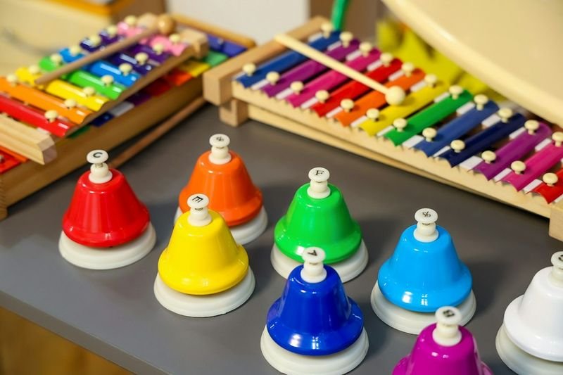 Classroom handbells and xylophones for musical-rhythmic intelligence ESL activity