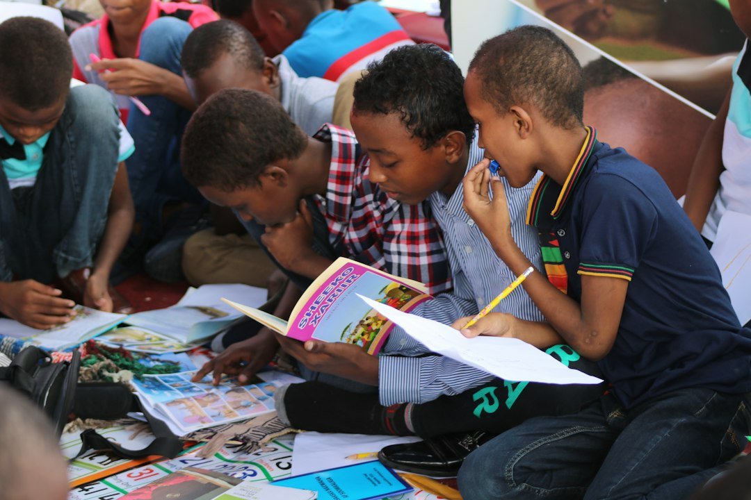 Teacher using the Natural Approach to read a picture book aloud to young ESL students