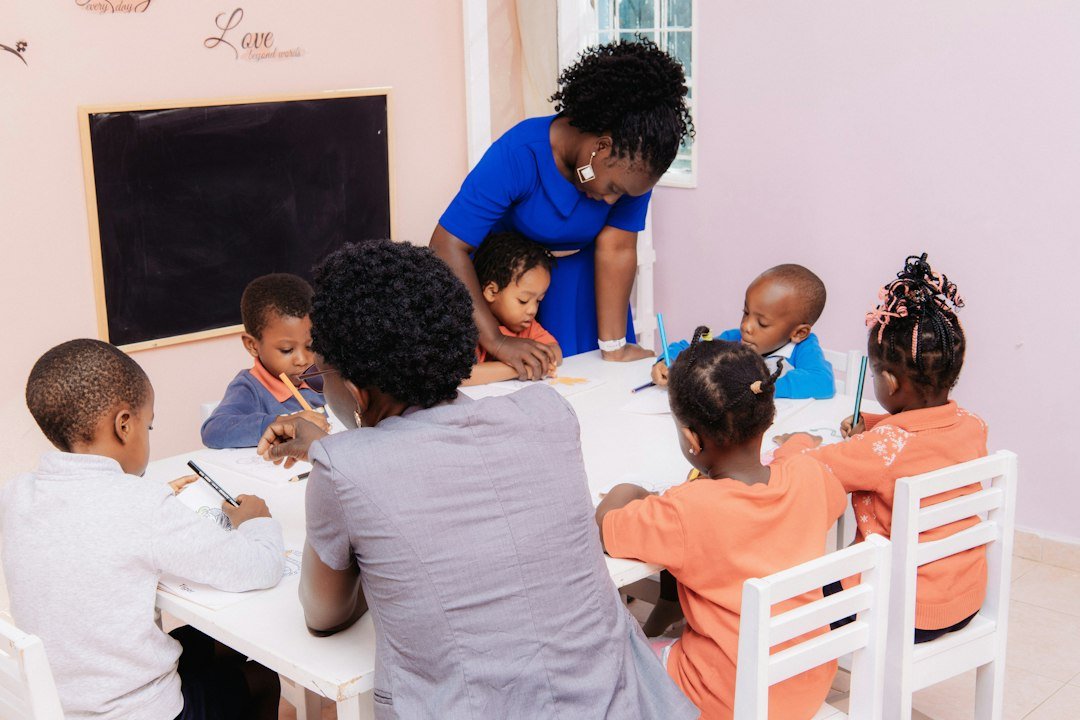 Teacher guiding young ESL children through a classroom activity